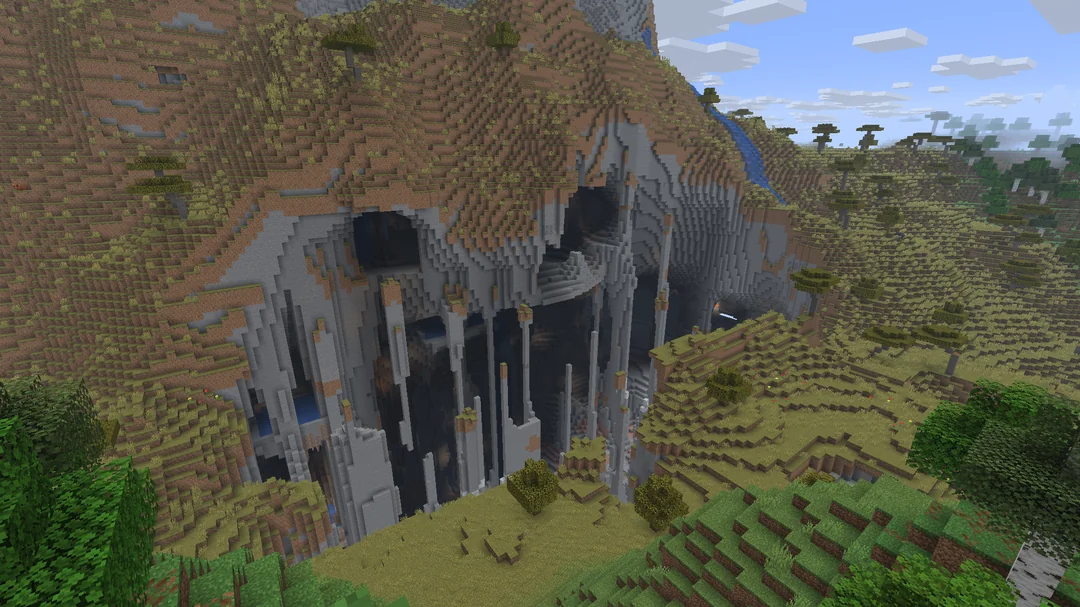 Minecraft seed with a rocky cliff that looks like a monster face near spawn (-6044780343592149694)